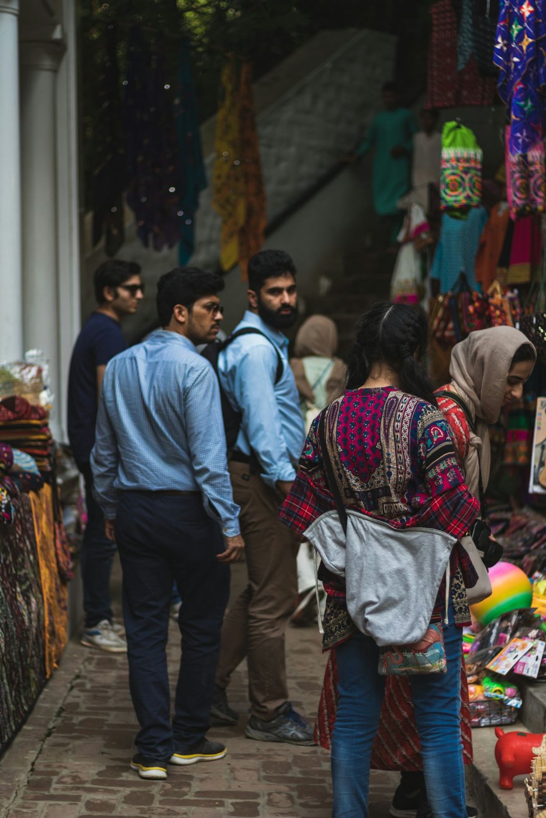 Shoppers walking through a busy market