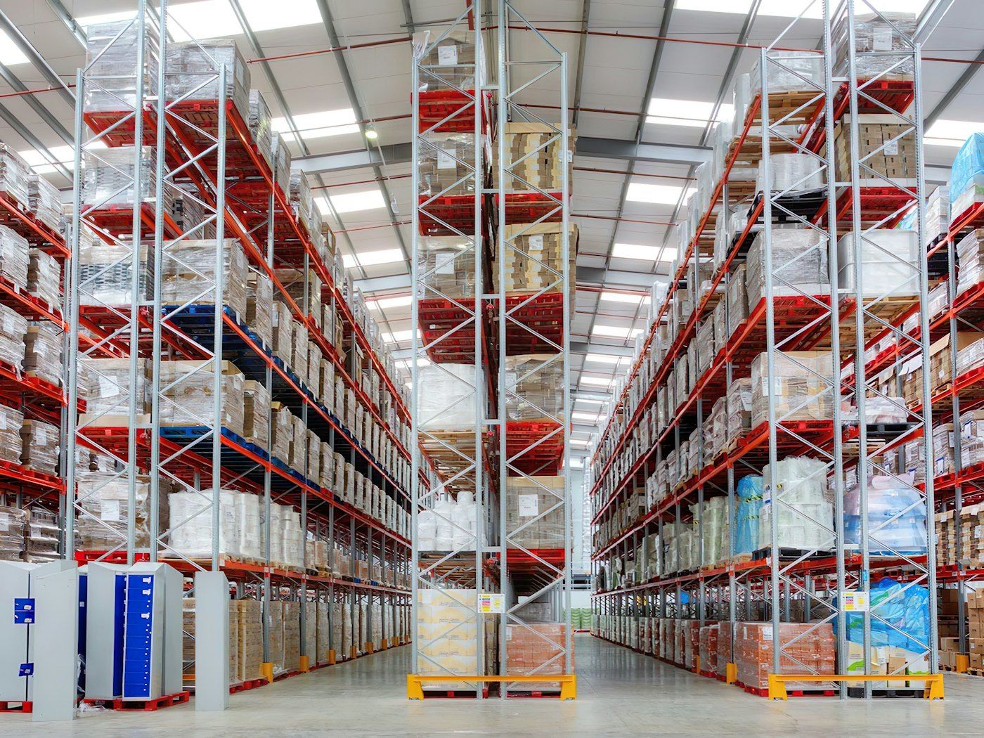 Tall shelves of stock in a warehouse